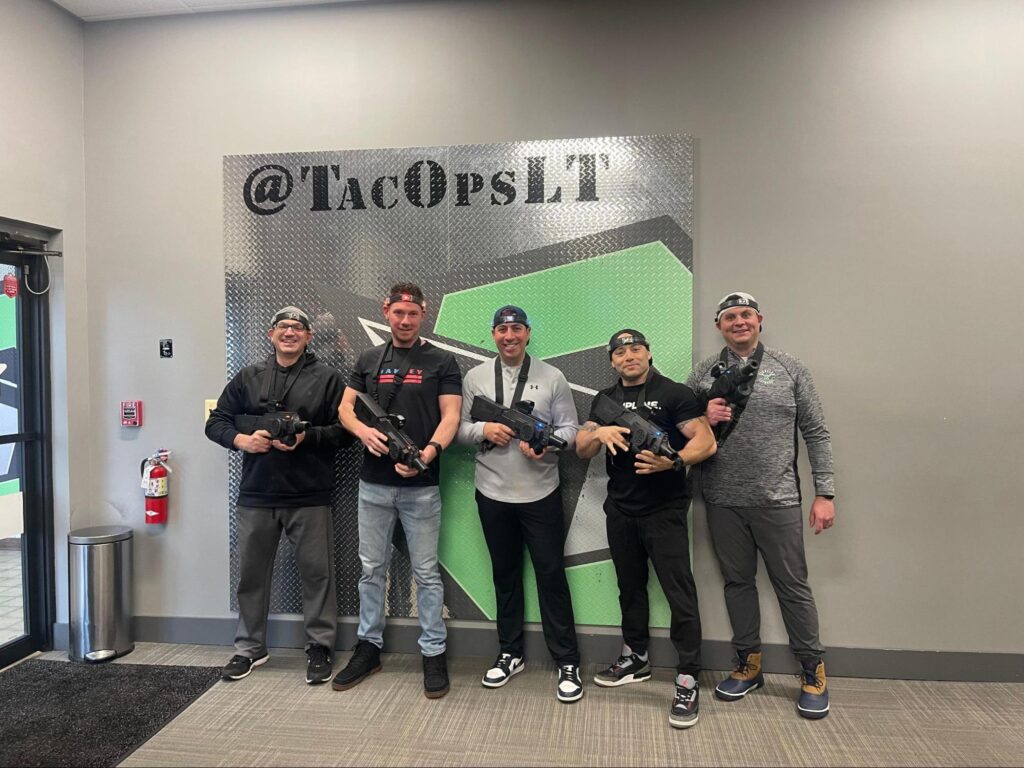 A team participating in laser tag at Tac Ops New Jersey, showcasing one of the top team building activities for work in New Jersey at the top laser tag arena.