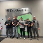 A team participating in laser tag at Tac Ops New Jersey, showcasing one of the top team building activities for work in New Jersey at the top laser tag arena.